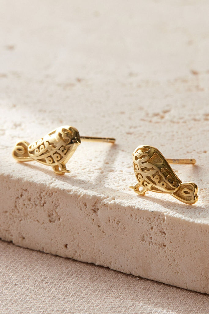 close up of the gold garden bird stud earrings