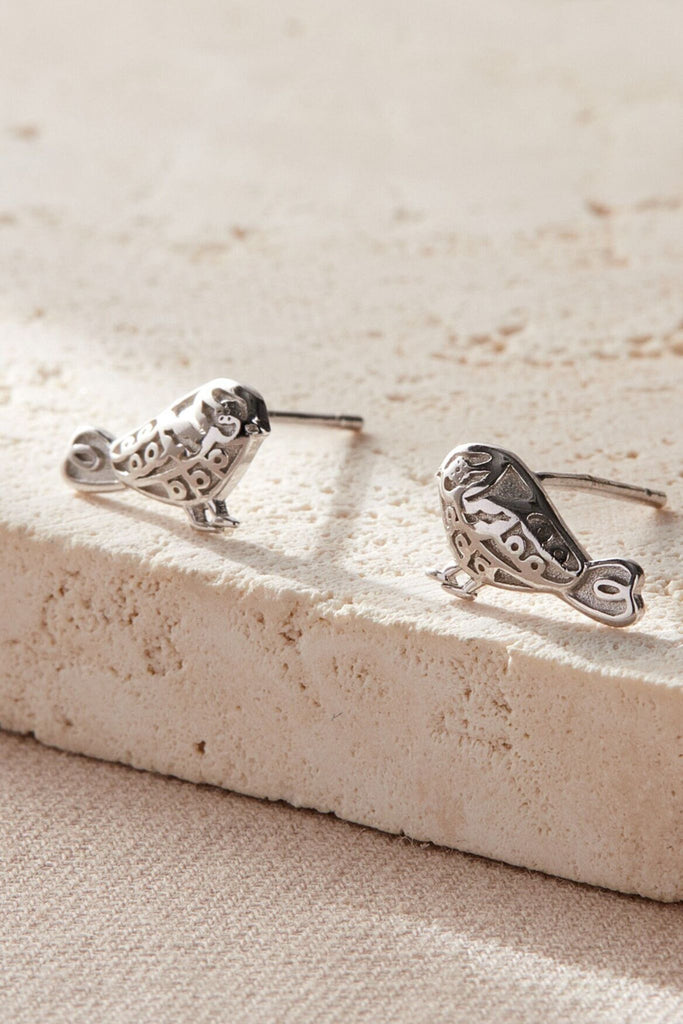 close up of the silver garden bird stud earrings