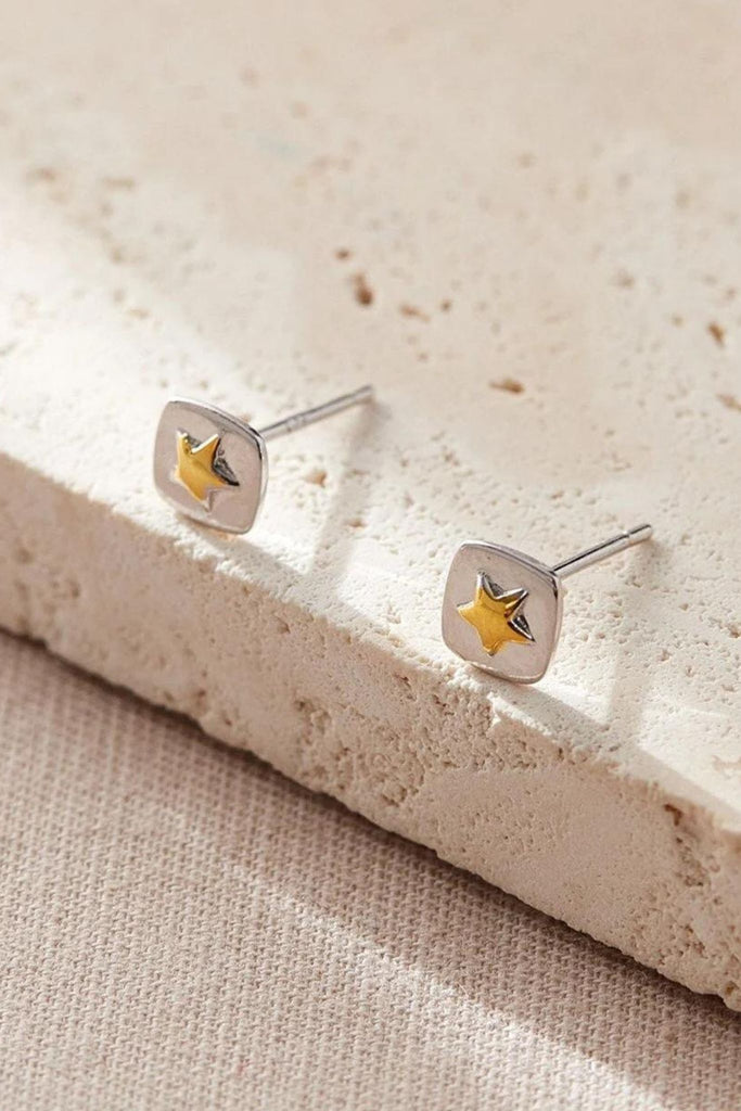 sterling silver square stud earrings with gold plated raised five pointed stars in the middle