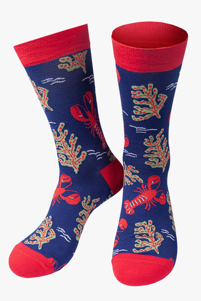 blue and red bamboo socks artistically designed to look like an underwater scene, with red lobsters and seaweed