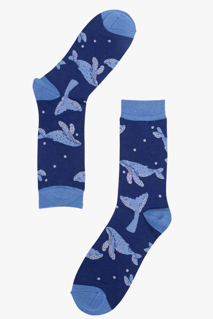 A pair of mens blue whale socks lying flat