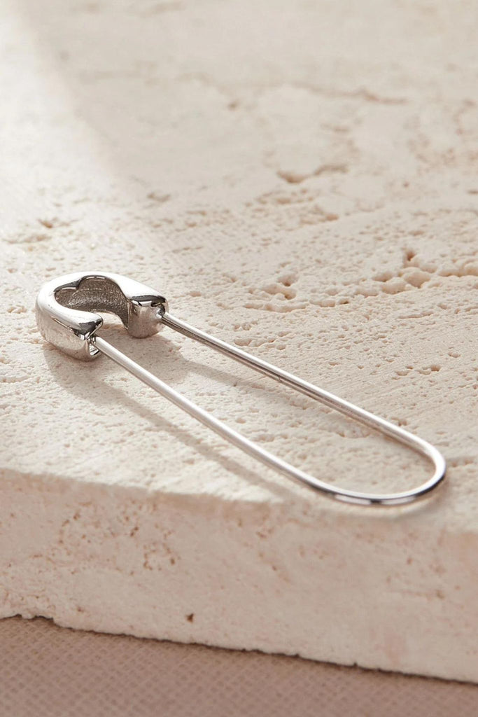 a single safety pin earring, showing that these can be sold as single units