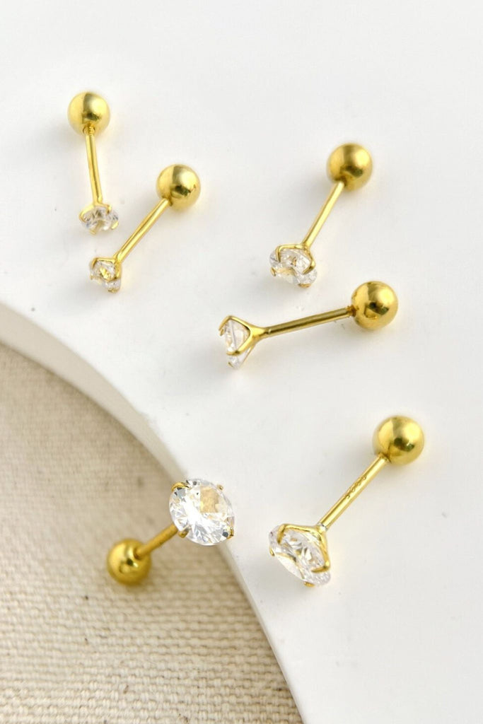 gold plated sterling silver cartilage stud earrings with screw on ball backs, the studs are made from a single white cubic zirconia crystal mounted in sterling silver, there are three sizes 3mm, 4mm and 5mm in this image