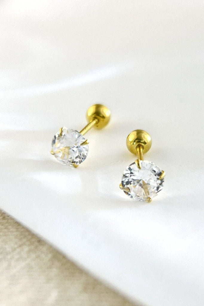 close up of the silver ball back stud earrings, showing the clear cz crystal and gold plated silver metal
