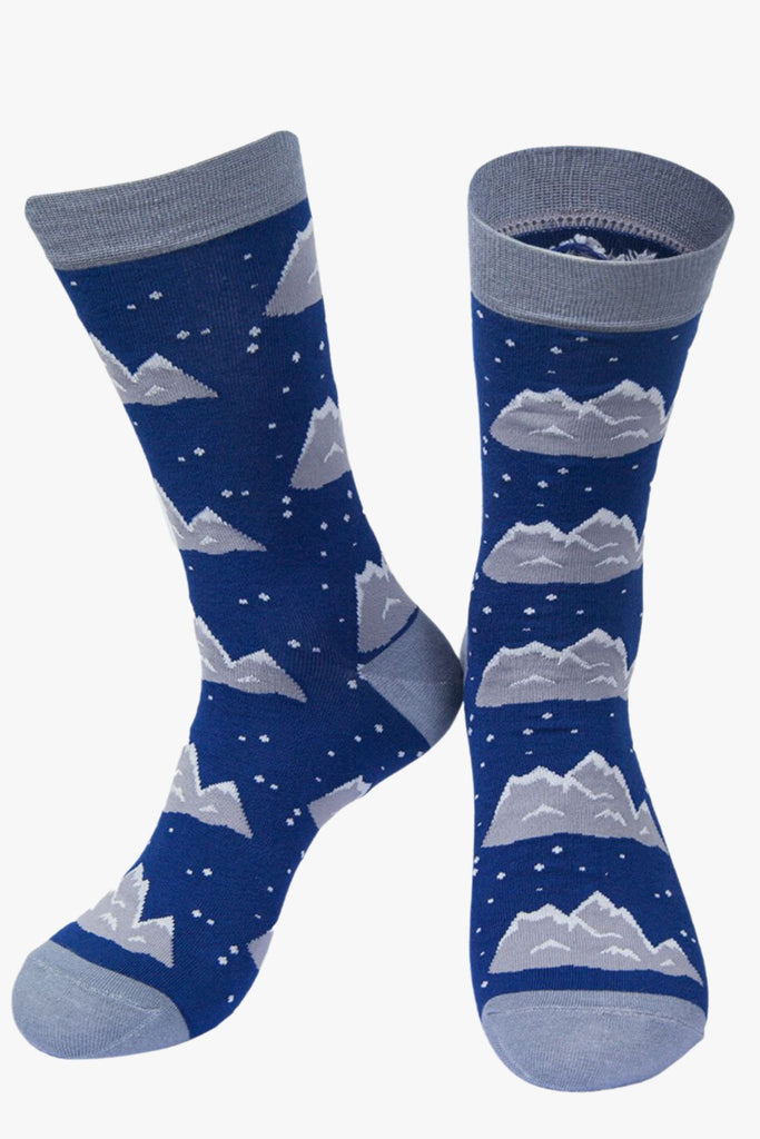 blue and grey bamboo dress socks with a snowy mountain and snowflake pattern design