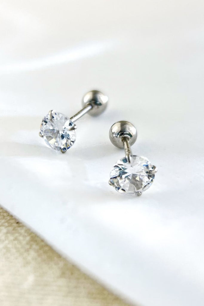 close up of the silver ball back stud earrings, showing the clear cz crystal and silver metal