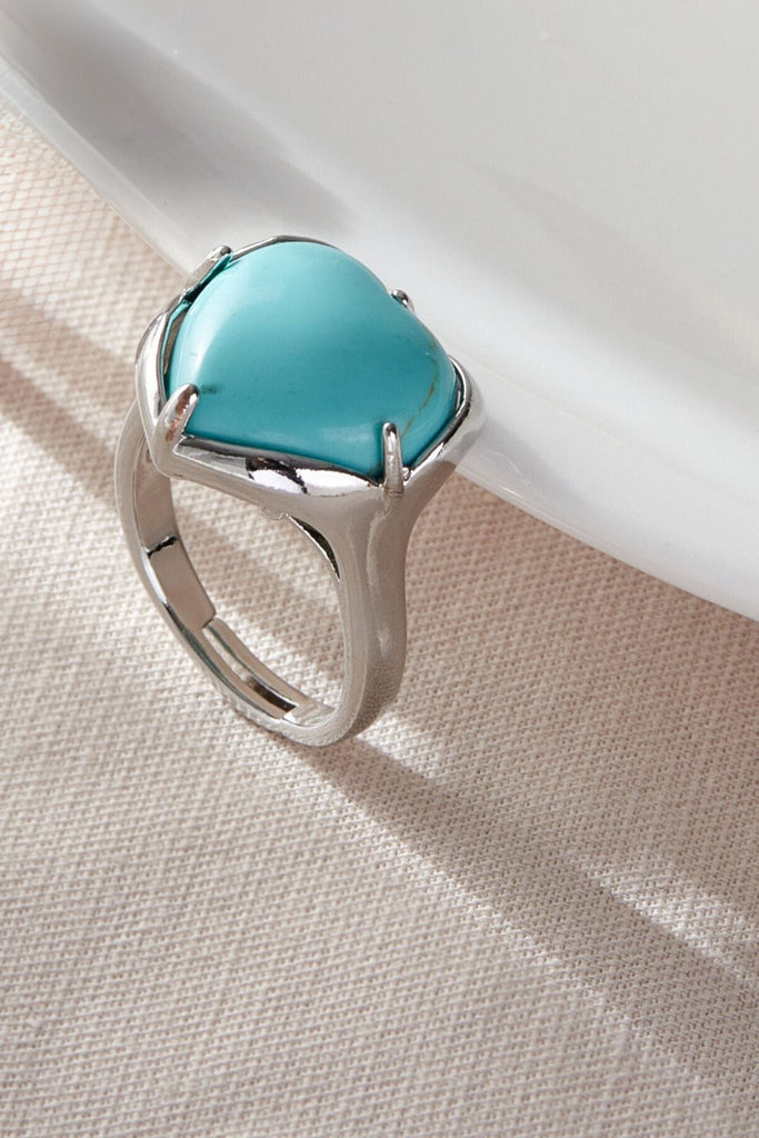 close up of the turquoise coloured sandstone heart  ring