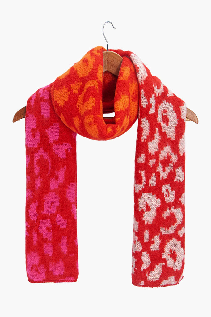 kyra-red-leopard-heavyweight-scarf-draped-on-coat-hanger
