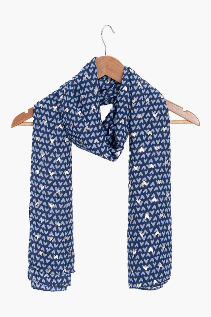 rainie-navy-blue-metallic-hearts-lightweight-scarf-draped-on-coat-hanger