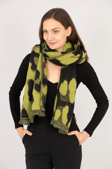 model wearing a lime green and black sparkly leopard print scarf