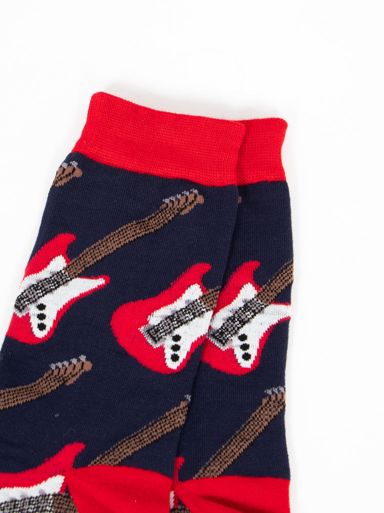 close up of the electric guitar design, the guitars are red and white and have six black strings.