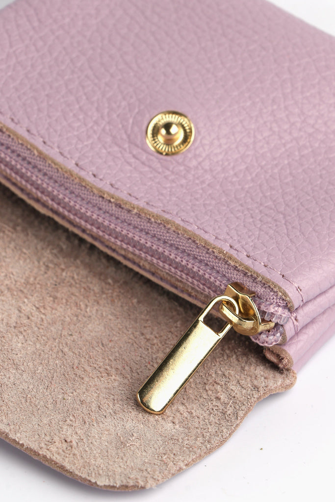 showing the internal zip closure compartment of this small lilac coin purse