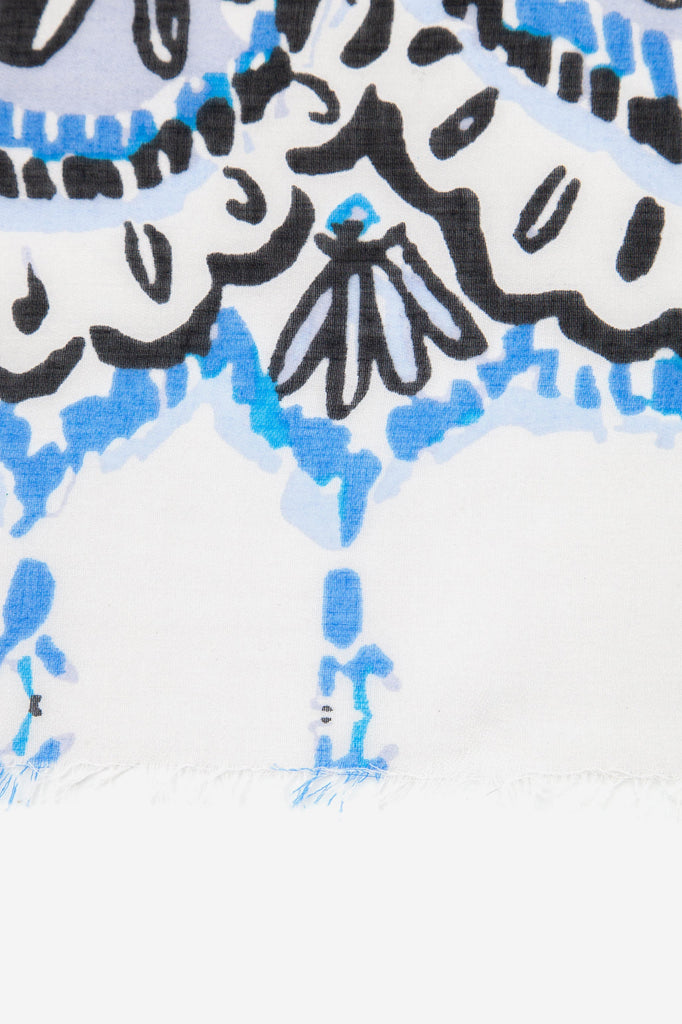 close up of the seashell pattern on the lightwieght scarf