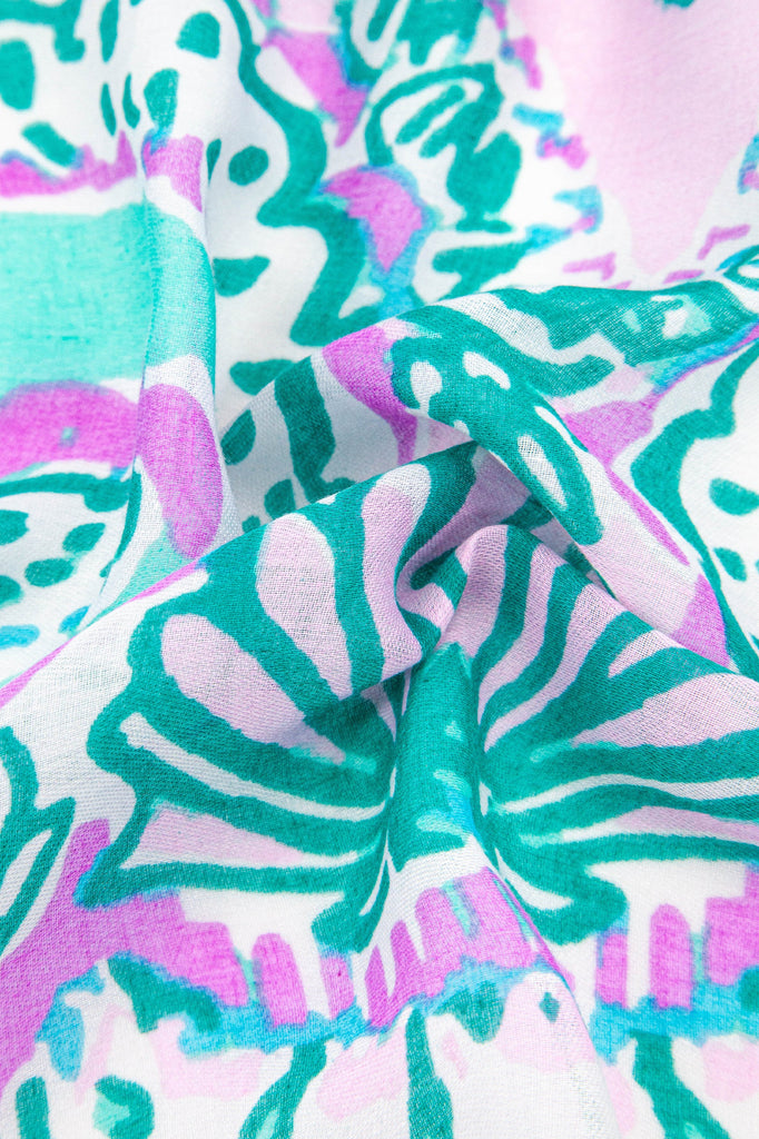 close up of the lightweight material and ornate seashell pattern