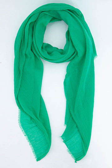 plain green lightweight summer scarf with a fringed edge