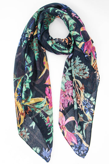 navy blue lightweight scarf with an all over bold floral pattern and subtle gold glitter stipe throughout