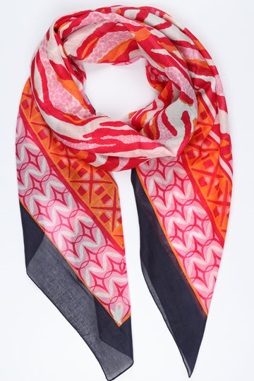 hot pink and navy blue animal print scarf with a navy blue mosaic print border