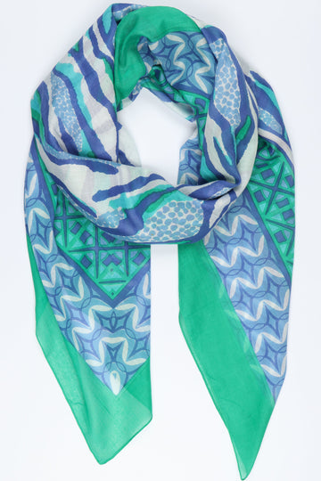 green and blue animal print scarf with a blue and green mosaic print border