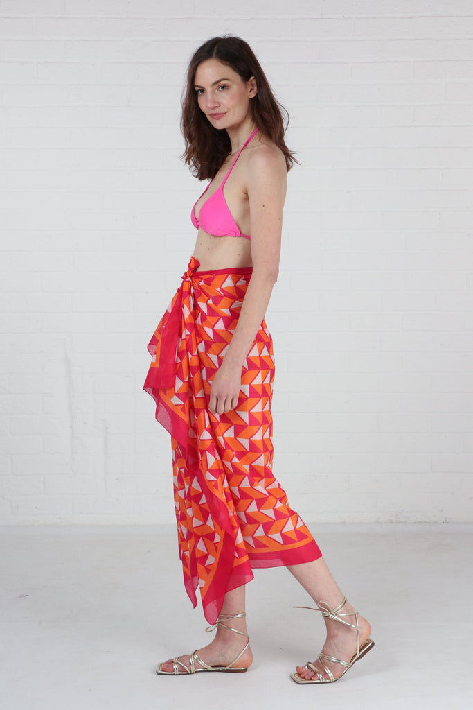 model wearing this geometic pattern scarf as a beach coverup sarong