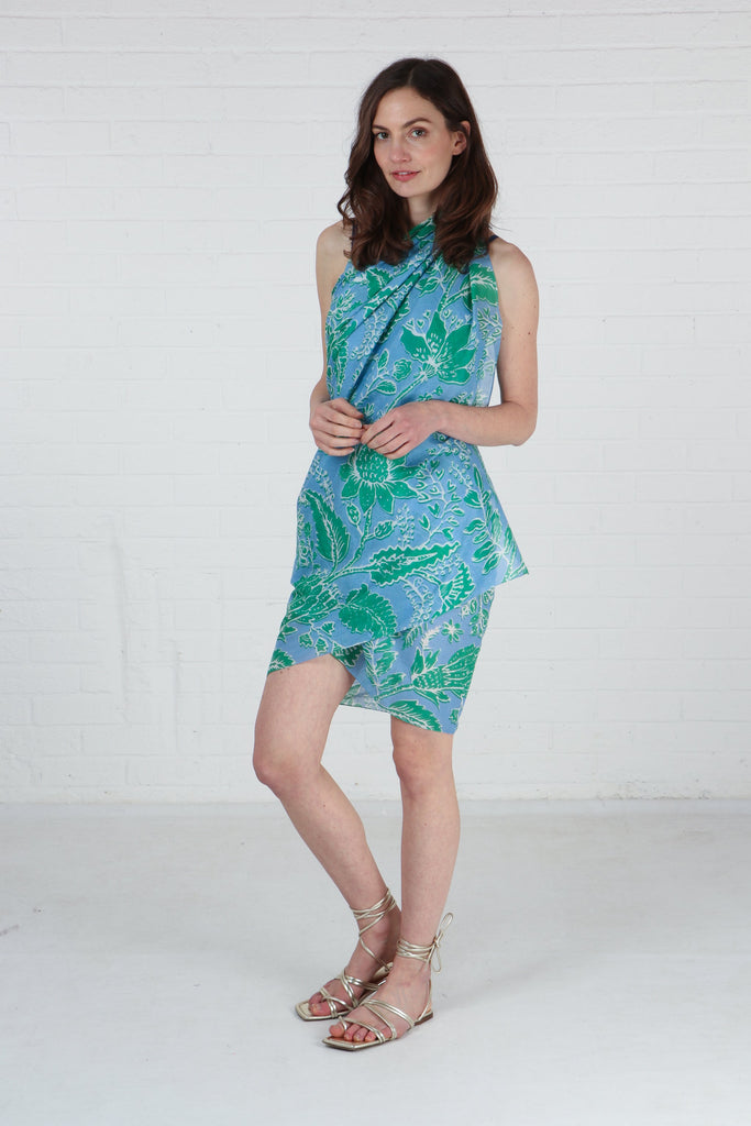 model showing that this cotton scarf can be worn as a beach cover up dress