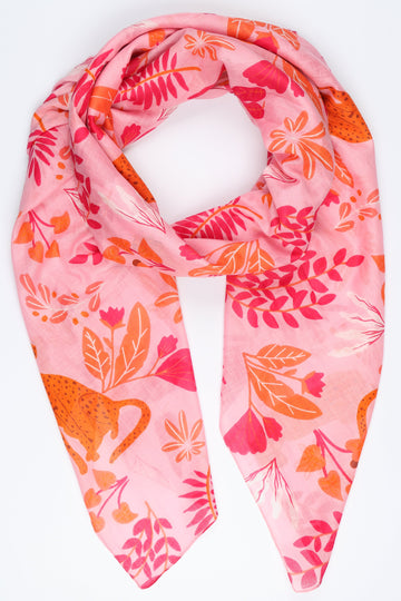 pink scarf with an all over pattern of leaves and cheetah cats in orange and pink