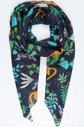 navy blue scarf with a cheetah cat in yellow and an all over floral leaf print in green and blue