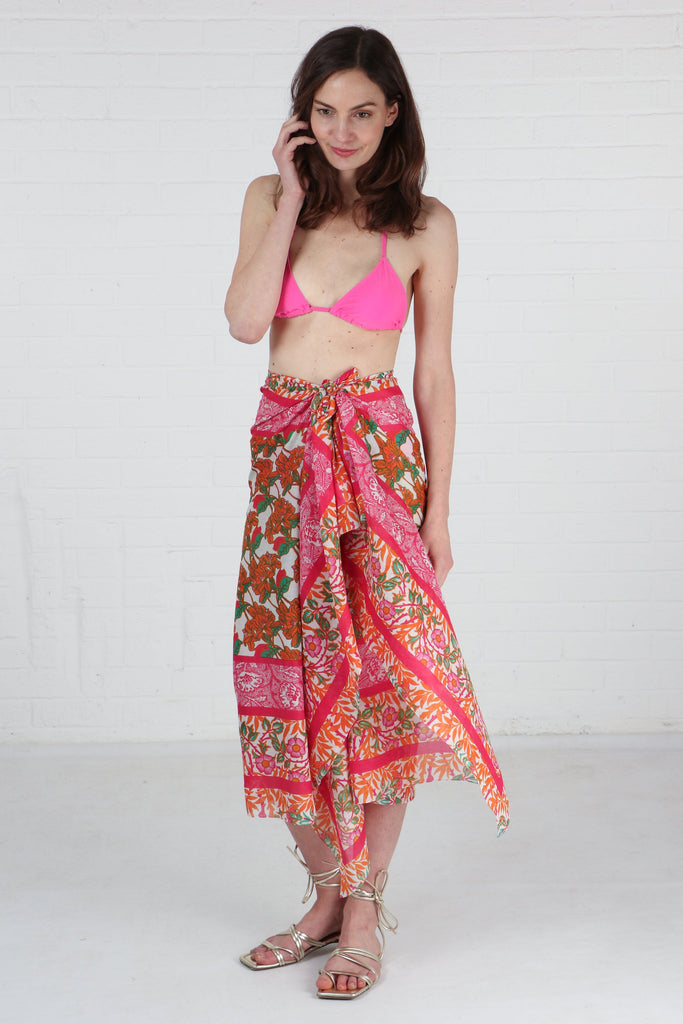 pink floral cotton scarf being worn as a sarong