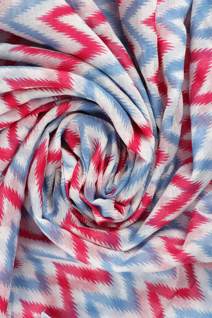 close up of the lightweight cotton fabric and contrasting blue and pink colours