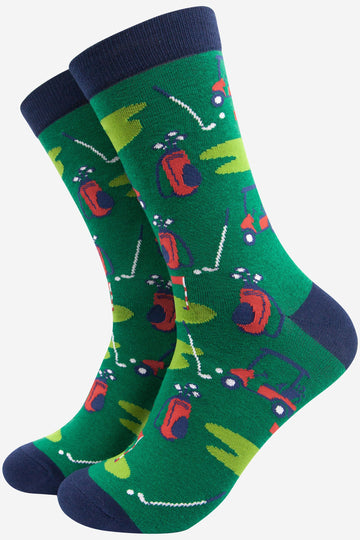 green bamboo golf socks featuring a putting green , golf carf and golf bag scene