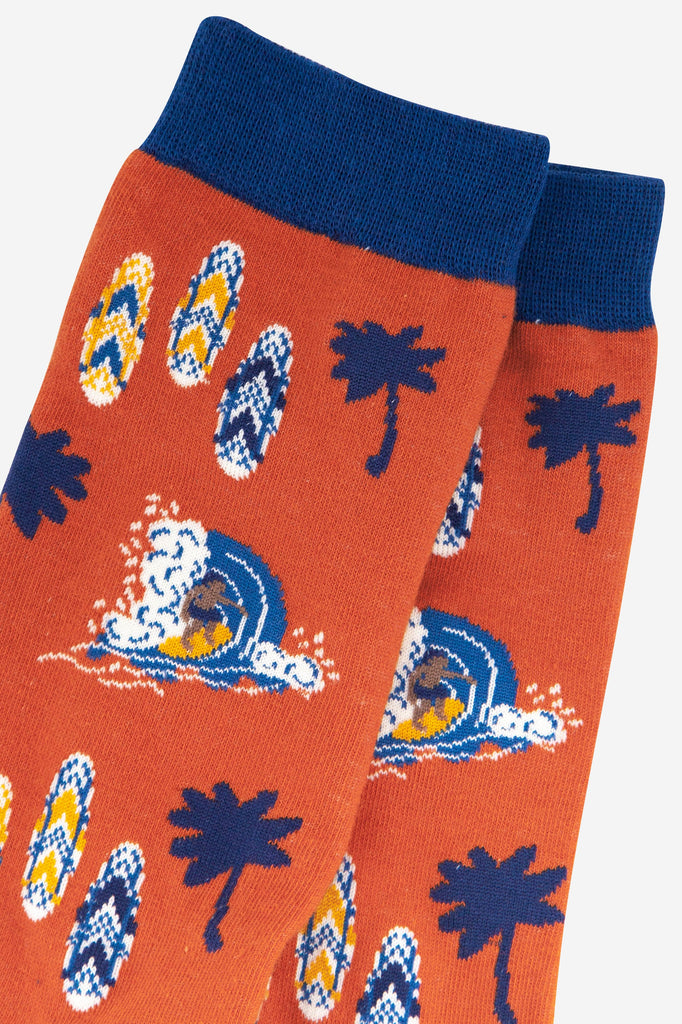 close up of the surfer and surf board pattern on the mens bamboo socks