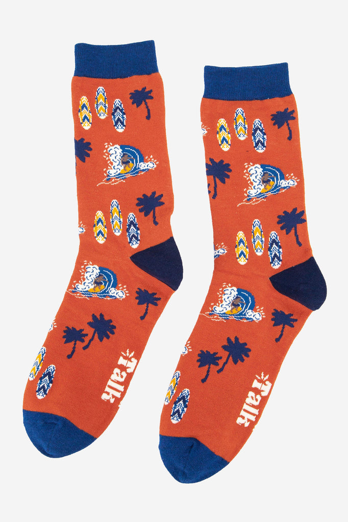 orange and blue bamboo socks with a surfer catching a wave