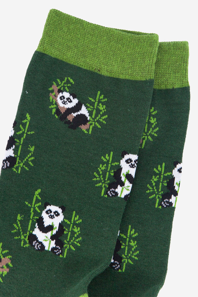 close up of the panda print, showing the giant panda relaxing in a tree and eating bamboo