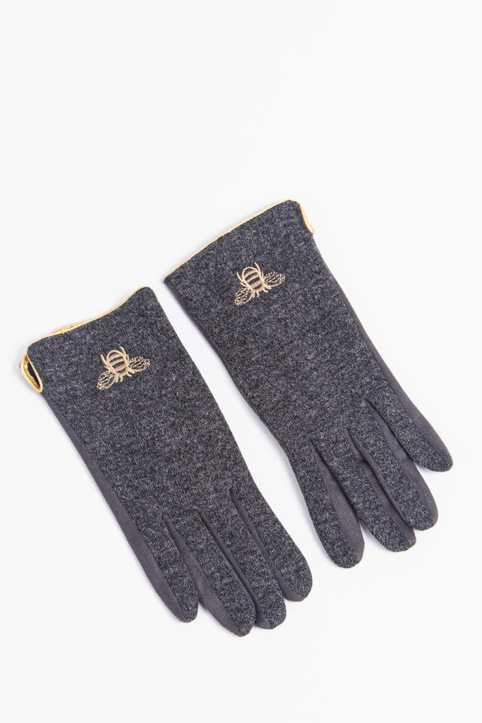 womens grey winter gloves with an embroidred gold bee on the wrist