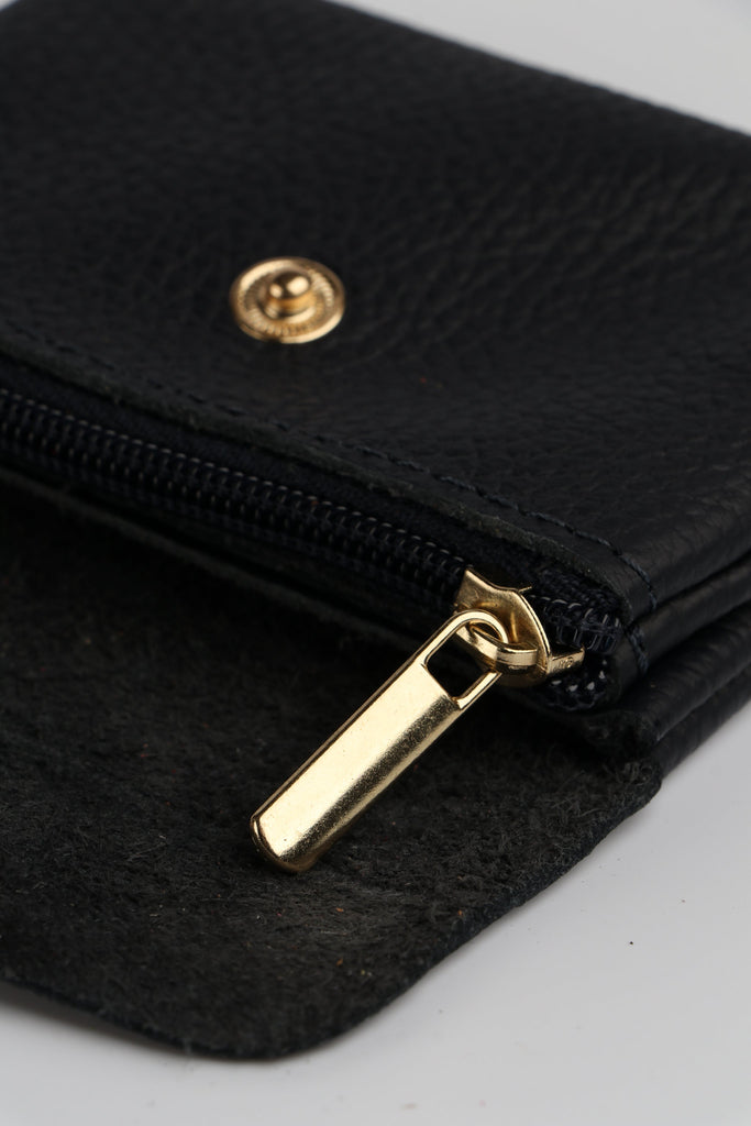 showing the inside of the leather coin purse with an internal zip compartment