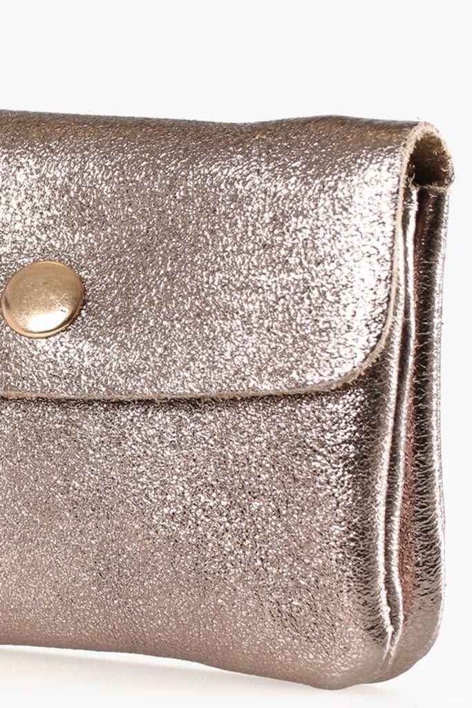 close up of the champagne rose gold coloured leather purse