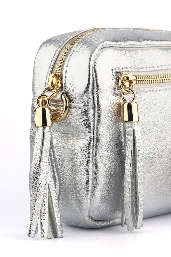 close up of the silver metallic leather of the camera bag