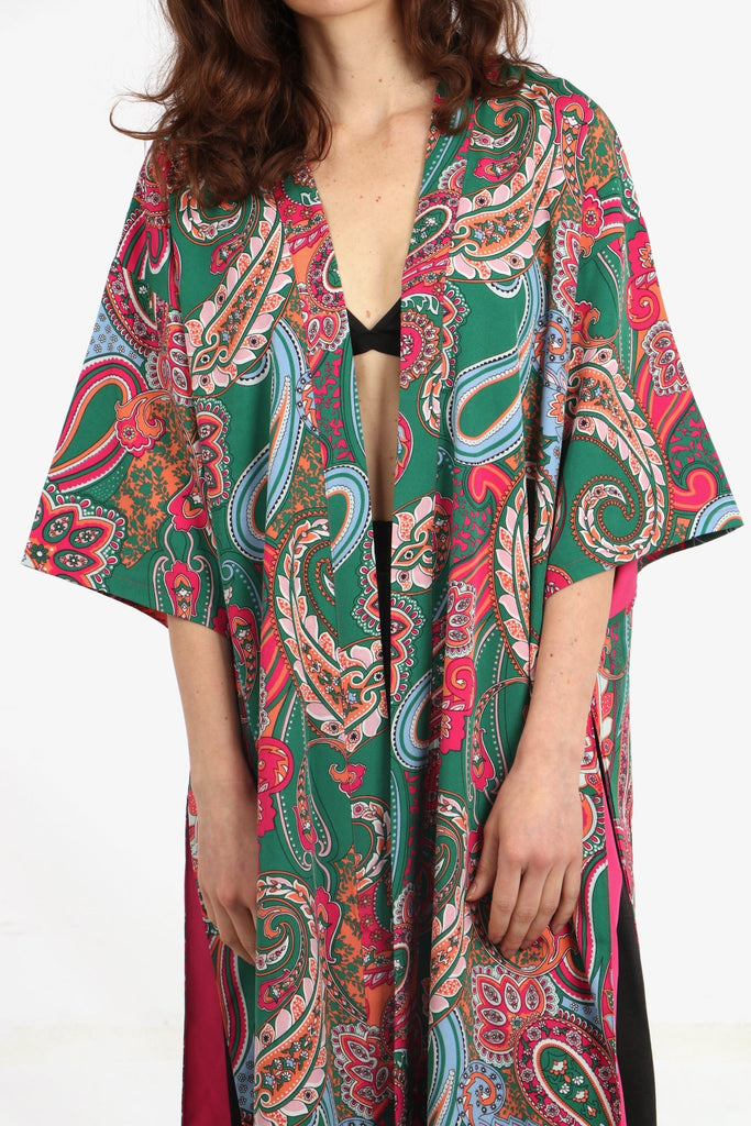 close up of the green and pink paisley print pattern on the open front kimono
