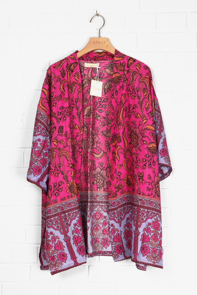 short pink floral print kimono draped on a coat hanger