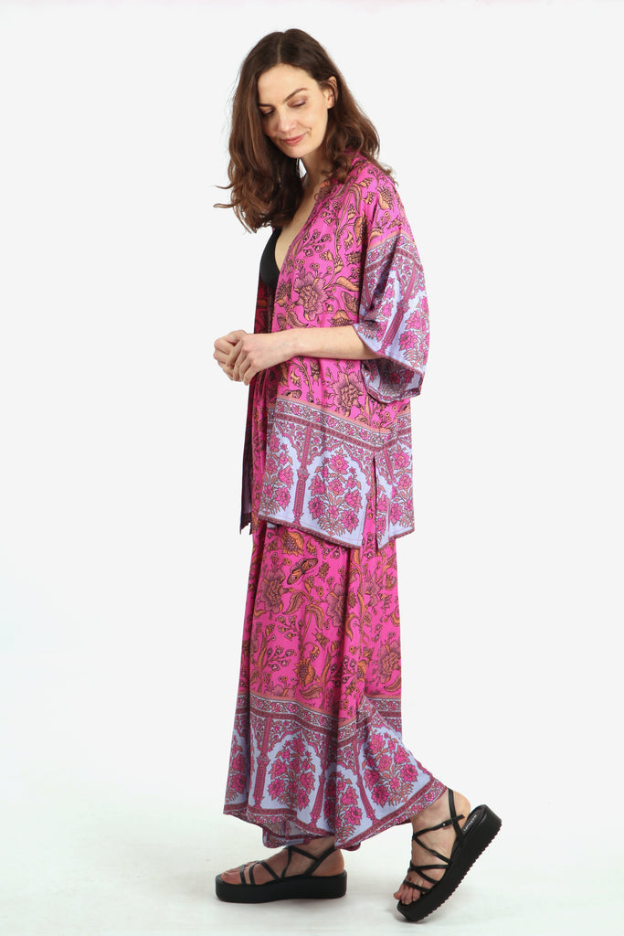 side view of the short kimono showing the 3/4 sleeves and all over ornate floral and butterfly design