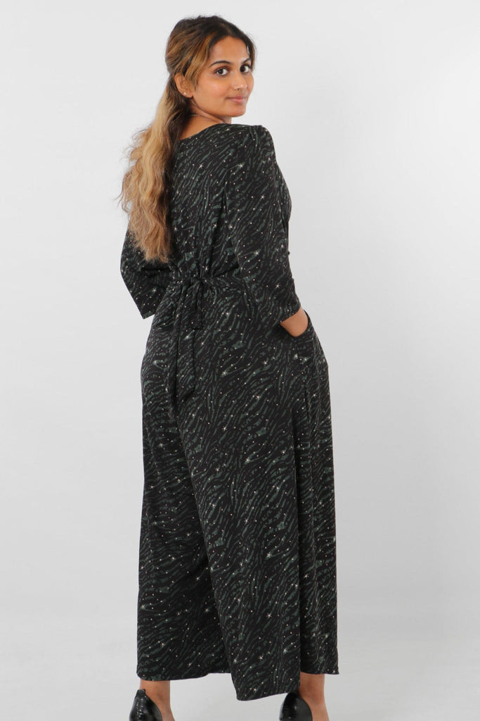 model showing the back of the jumpsuit and waist tie