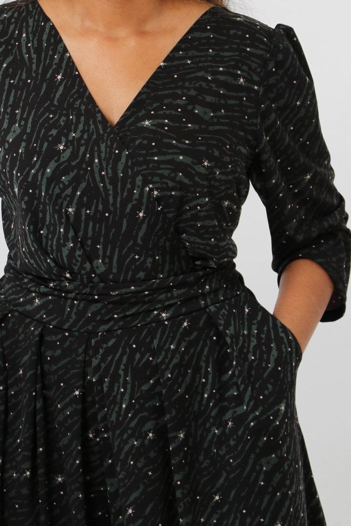 close up of the black and khaki zebra and star print pattern