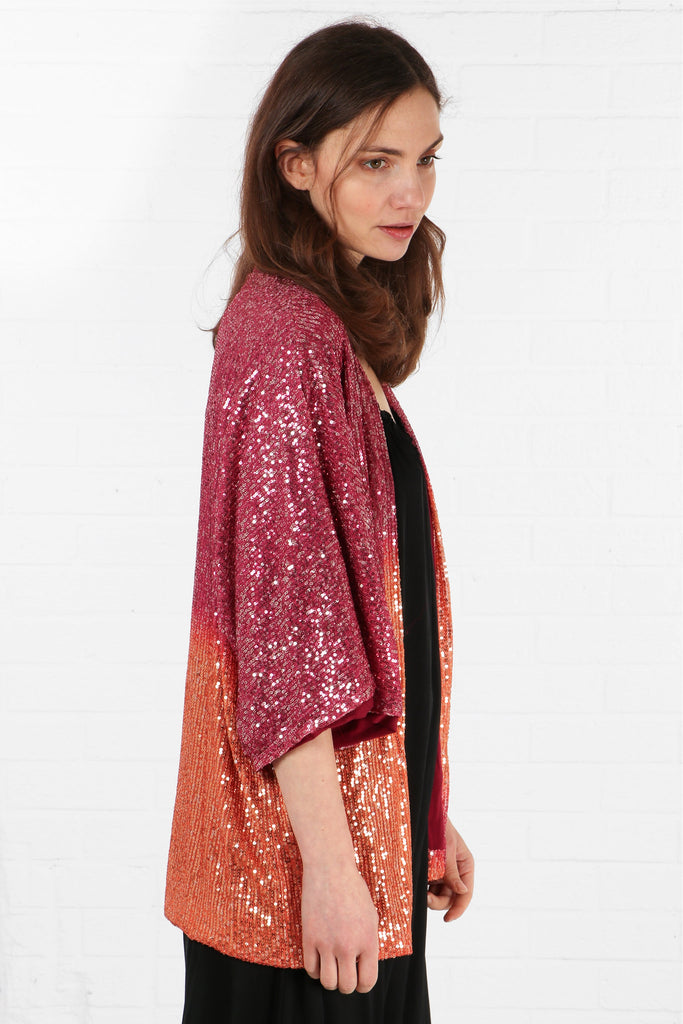 model showing side view of sparkly sequin kimono jacket showing all over sequin coverage