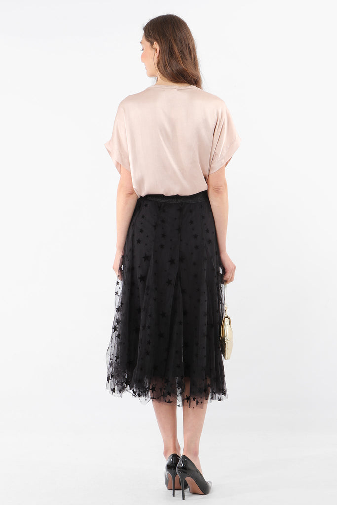 model showing the back of the black midi skirt