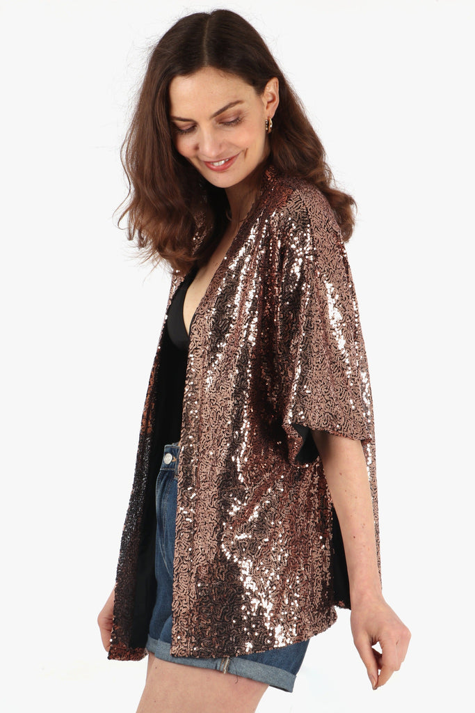 close up of the bronze sequin jacket showing the all over sparkle effect