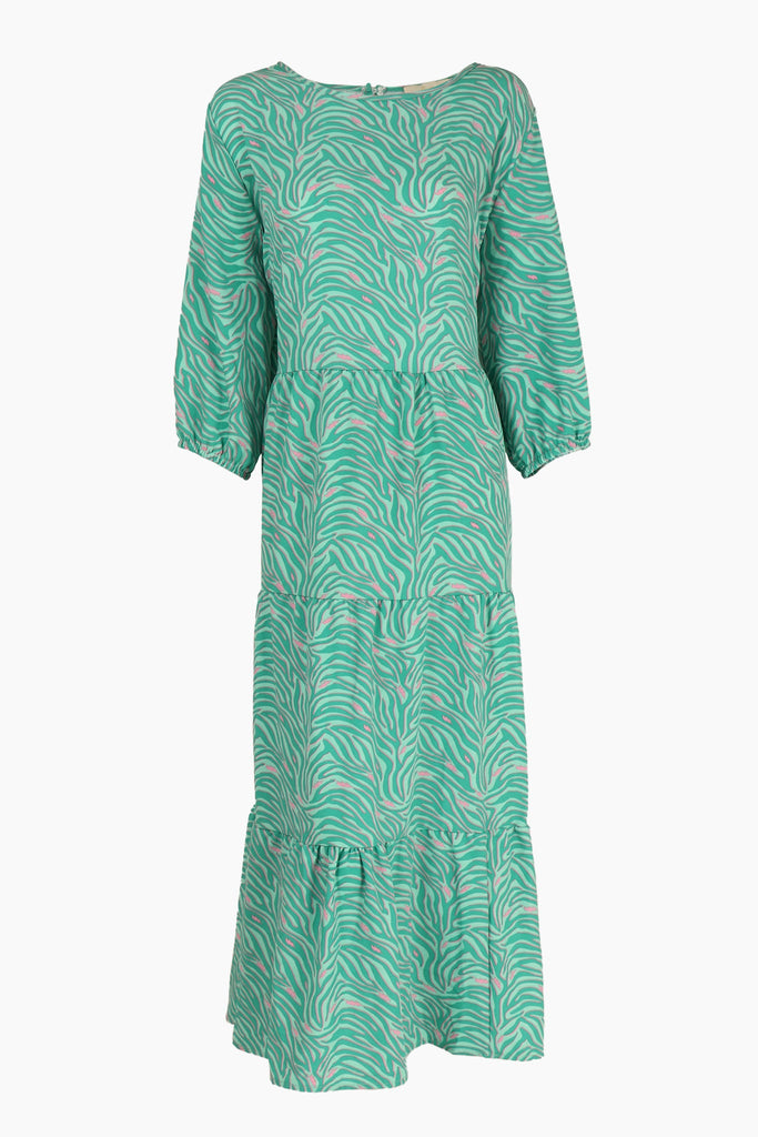 close up of the green and pink zebra and lightning bolt patten on the dress