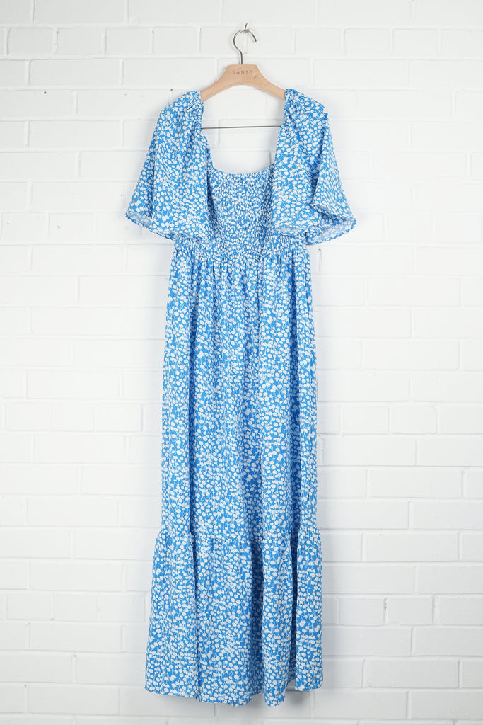 blue and white ditsy floral milkmaid dress on a coat hanger