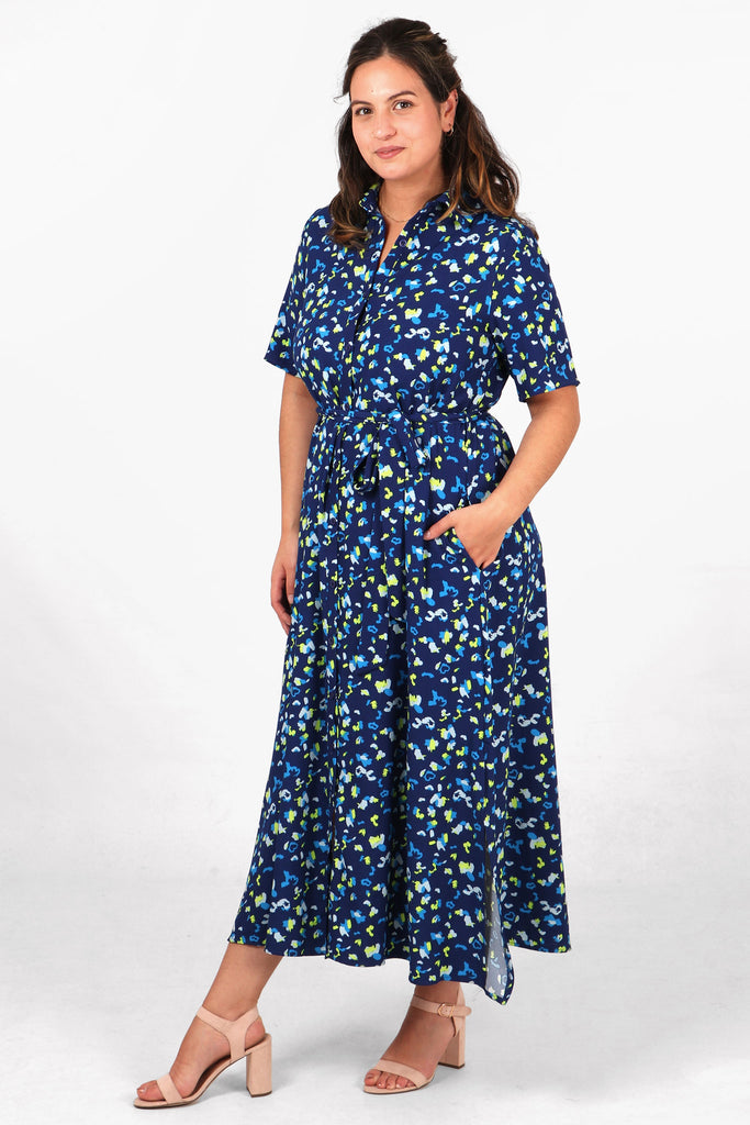 model showing that this maxi shirt dress has pockets