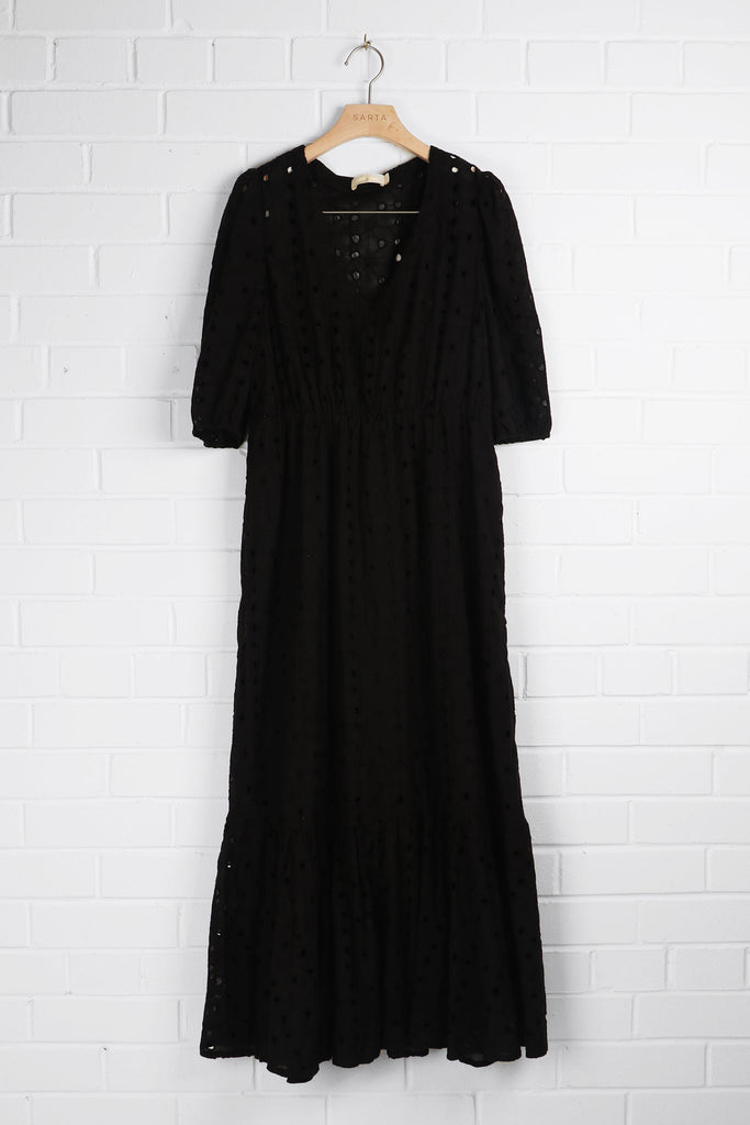 black broderie anglaise summer maxi dress hanging on a coat hanger