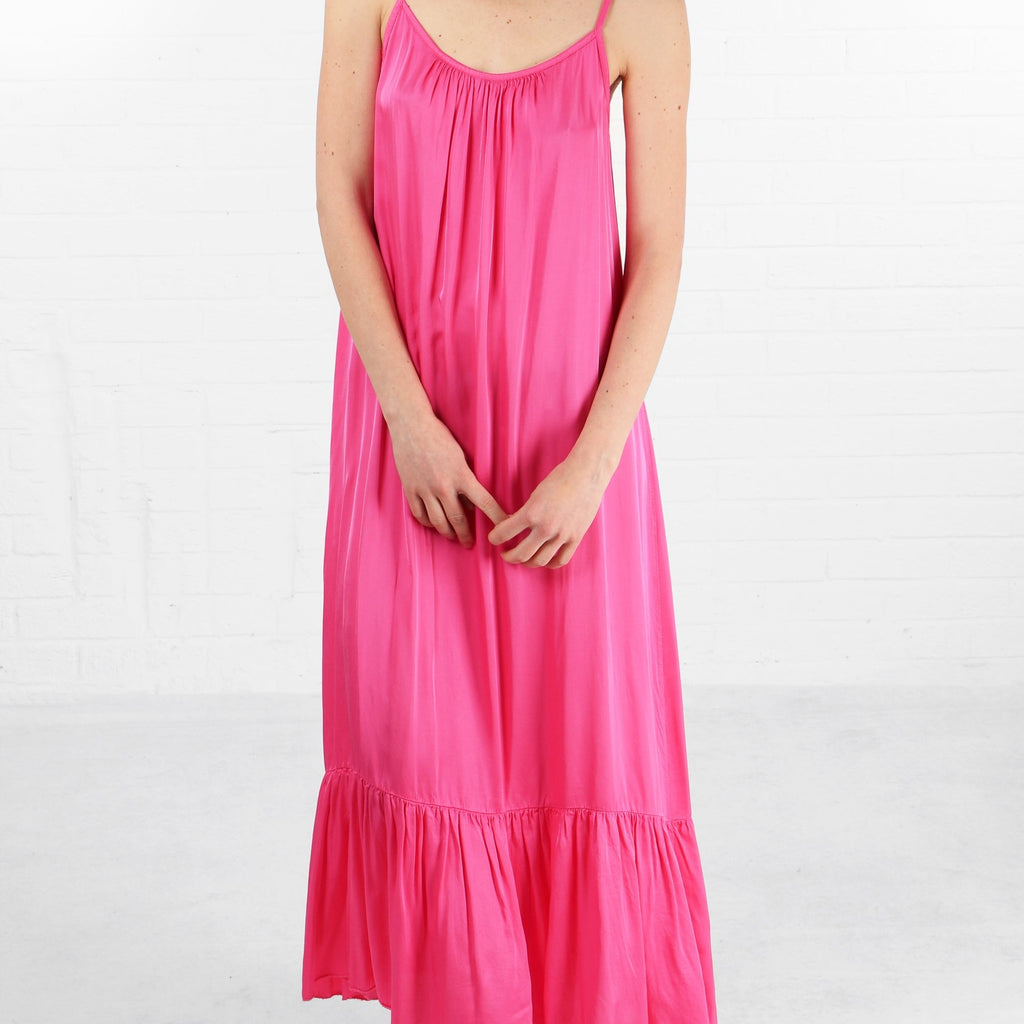 plain pink maxi sundress with thin shoulder straps and a loose fitting design