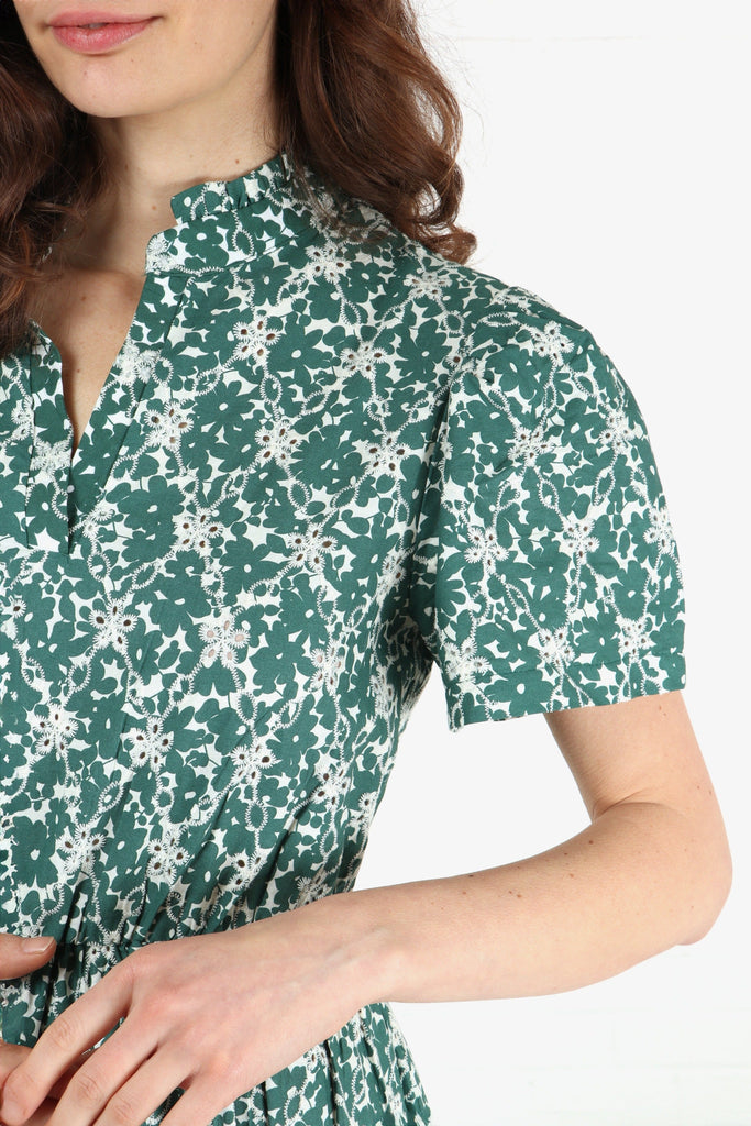 close up of the floral pattern broderie anglaise detail